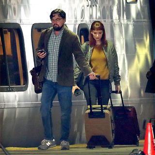 boston, ma december 1 actors leonardo dicaprio and jennifer lawrence walk along the train platform next to an acela train at south station during on location filming of dont look up at south station in boston on dec 1, 2020 the film stars jennifer lawrence, leonardo dicaprio, meryl streep, and is directed by adam mckay photo by david l ryanthe boston globe via getty images