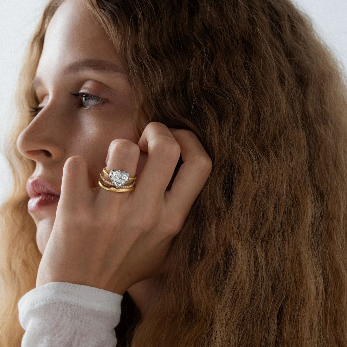 a model wearing engagement ring by jessica mccormack