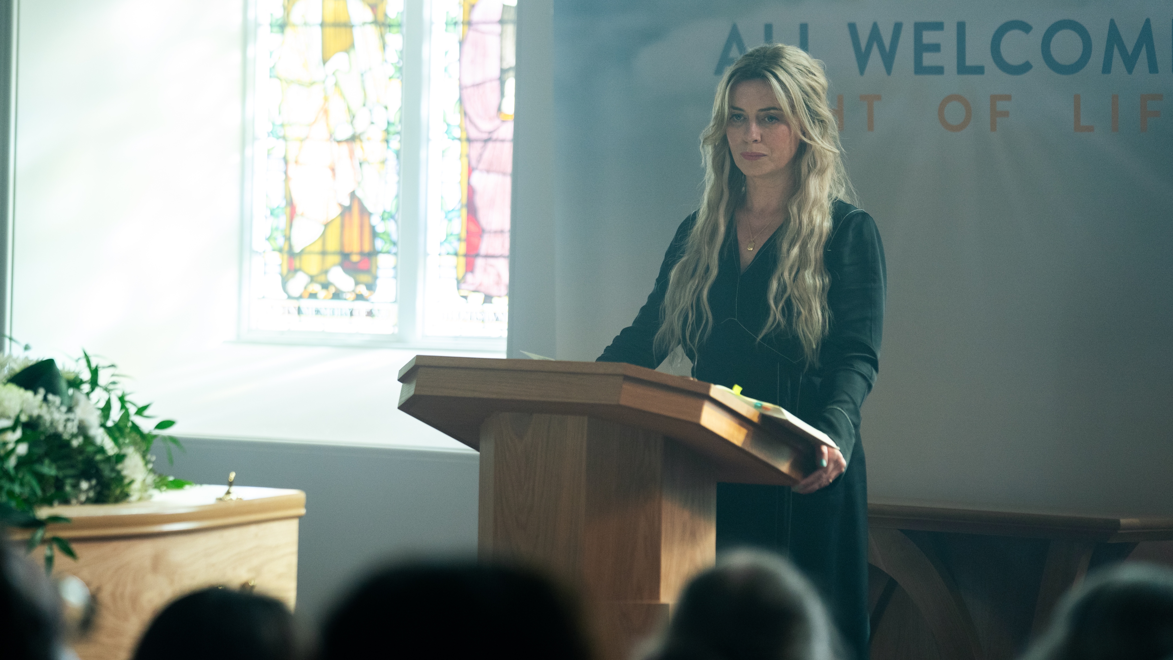 Rebecca (Eve Myles) addresses the people of Coldwater at the local church