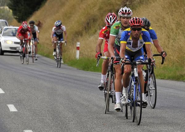 The leading group headed by Heath Blackgrove of Team Solway are nearing the summit of Te Wharaw Hill