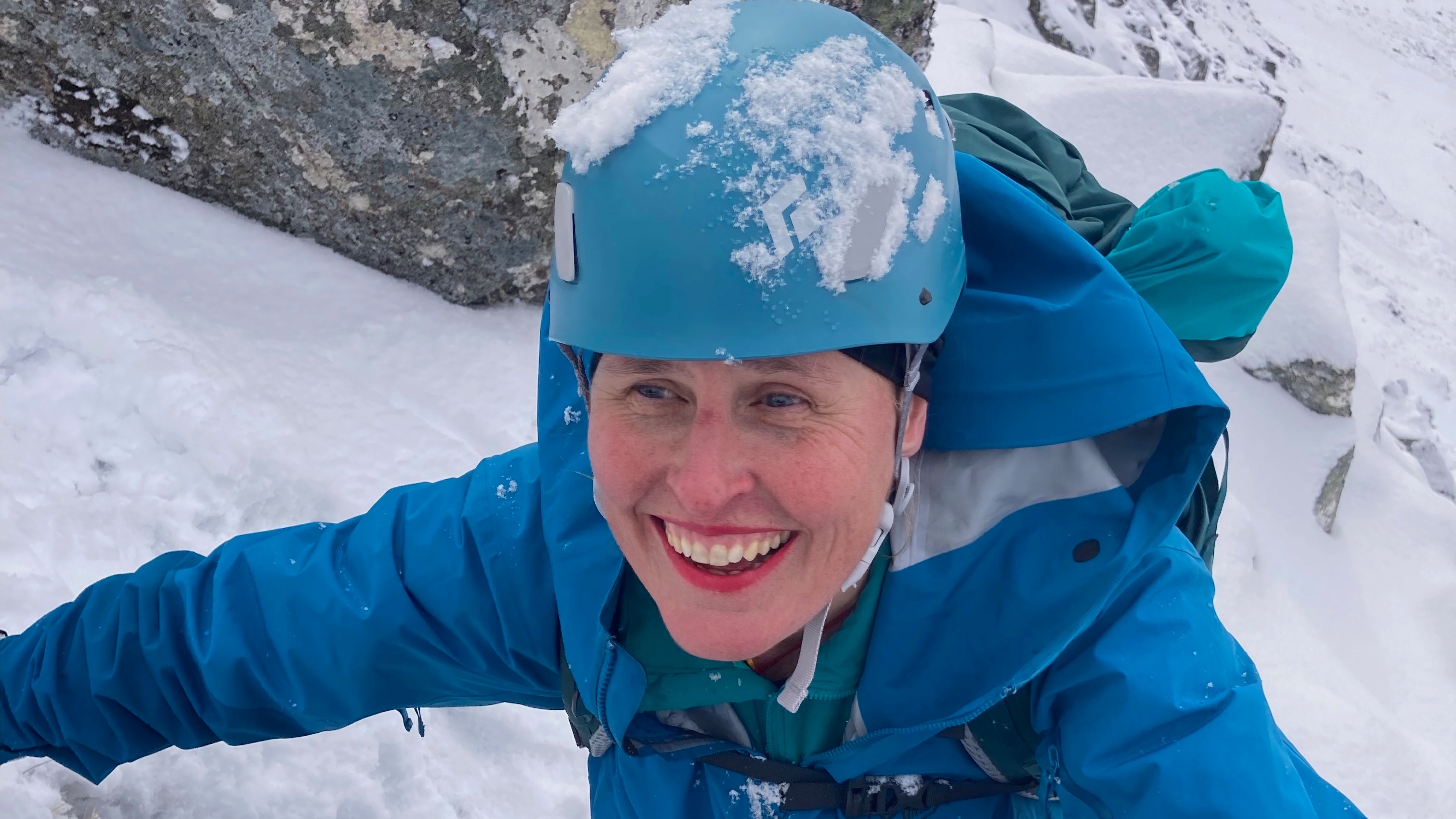 Jessica Hepburn smiling as she climbs Mount Everest in the snow