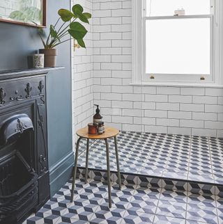 Shower room with fireplace and geometric tiled floor
