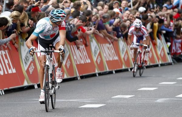 Gilbert looks back before raising his arms in victory.