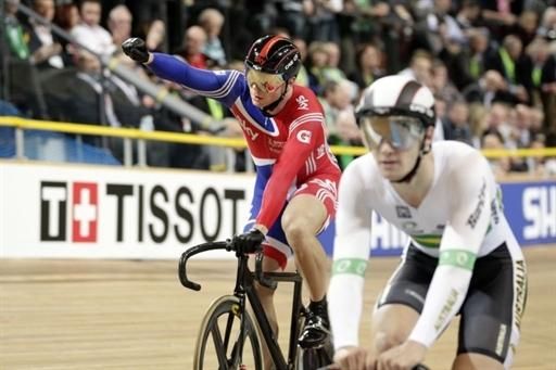 Britain's Sir Chris Hoy celebrates after winning beside Matthew Glaetzer from Australia during the quarter finals of the men's sprint