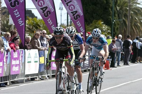 Michael Cupitt (Merida Australia Road Team) leads Patrick Lane (Team Jayco Skins) and Matthew Wheatcroft (BlackPeloton) up the home straight with around a 30 second lead over the peloton.