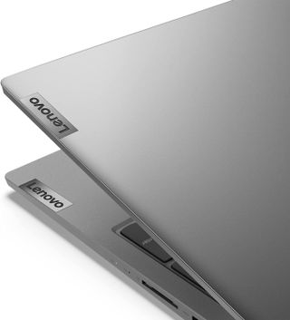A silver Lenovo half-closed on a white background