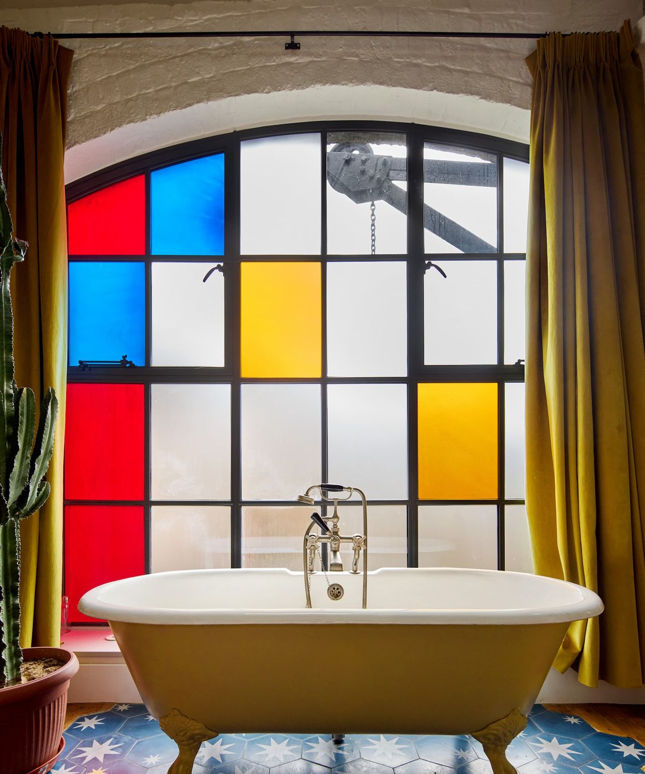 A bath next to stained glass windows