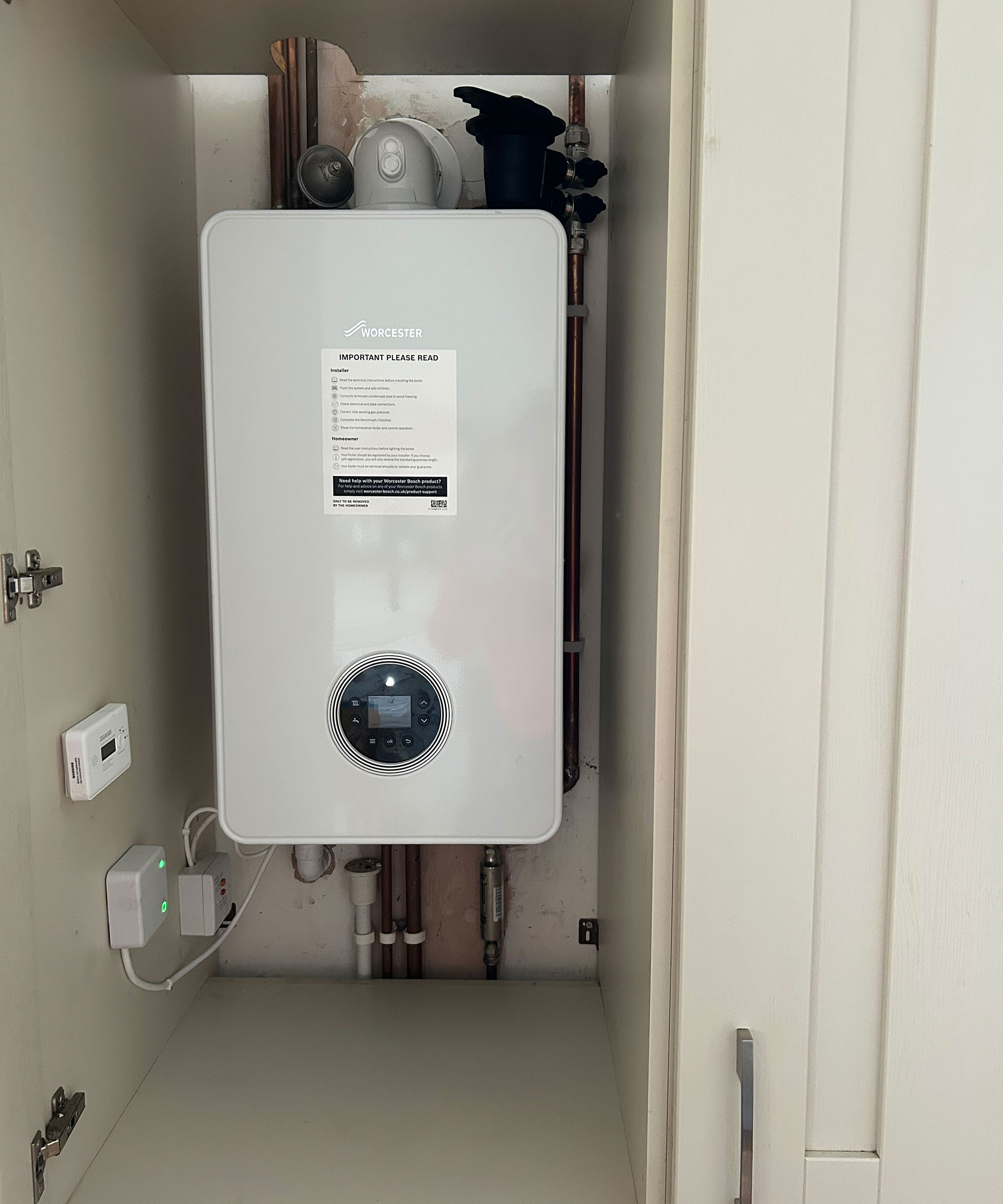 Worcester Bosch boiler fitted in a kitchen cupboard
