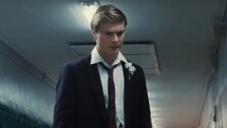 Sam Rechner in a suit looking angry in The Fabelmans