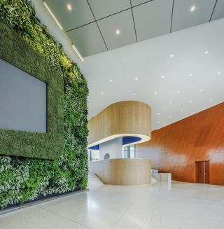 greenery and bespoke details in bank in Peru by WorkAC