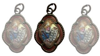 A pendant featuring Moses holding the Ten Commandments, which was found by the gas chambers located in Camp II at Sobibor.