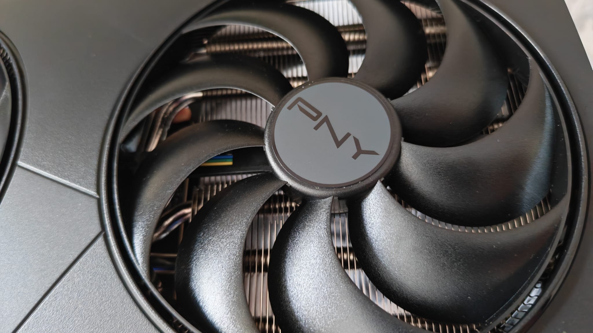 A close up of one of the fans in the PNY GeForce RTX 5080 OC Slim