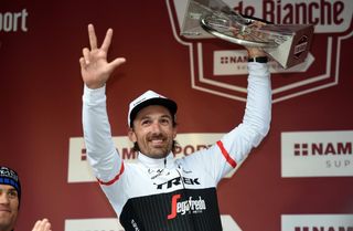 Fabian Cancellara celebrates his victory on the podium, showing everyone how many times he has won the race in its 10-year history.