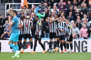 Newcastle players celebrate one of their goals against Tottenham in the Premier League in April 2023.