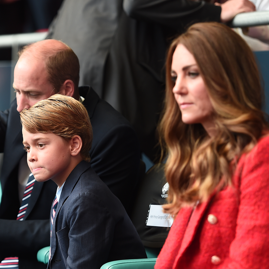 Prince George watches football with his parents