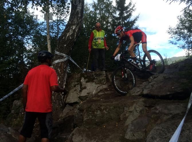 A US Team rider practices The Gully with advice from a coach