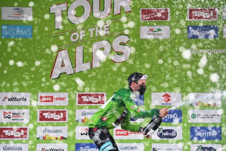 PIEVEDIBONO ITALY APRIL 22 Podium Simon Yates of United Kingdom and Team BikeExchange green leader jersey celebrates during the 44th Tour of the Alps 2021 Stage 4 a 1686 to stage from Naturns to Valle del Chiese Pieve di Bono Mask Covid safety measures Champagne TourofTheAlps TouroftheAlps on April 22 2021 in Pieve di Bono Italy Photo by Tim de WaeleGetty Images