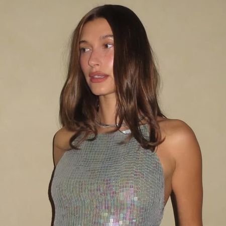 Hailey Bieber celebrated her 29th birthday in a vintage DKNY sequin top and flared jeans