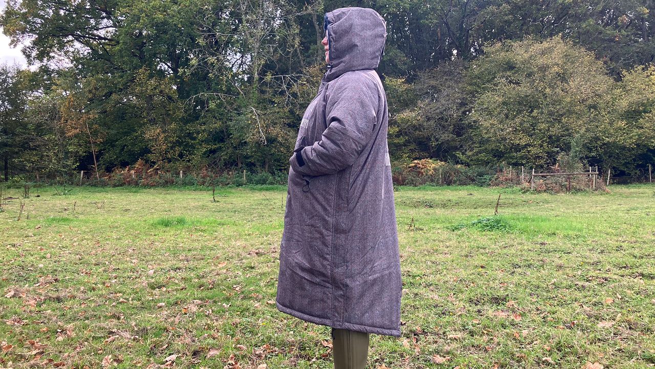 Lady wearing Hestt Eco-Ultra Riding Robe with hood up side view