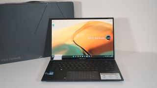 ASUS Zenbook 14 (UX3402ZA) on a table with box