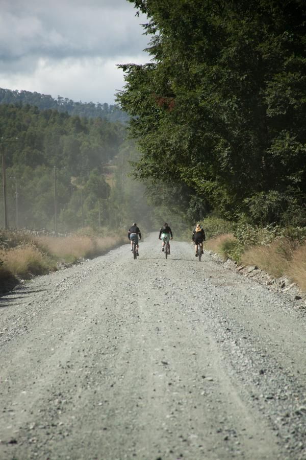 Three riders on the dirt roads of Chile