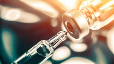 A vaccine vial and syringe.