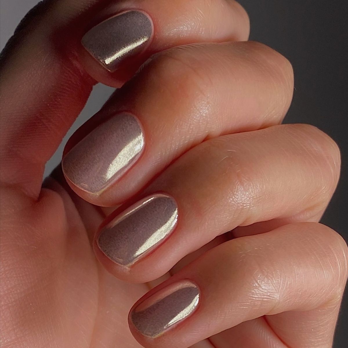 A close-up of glass chrome nails