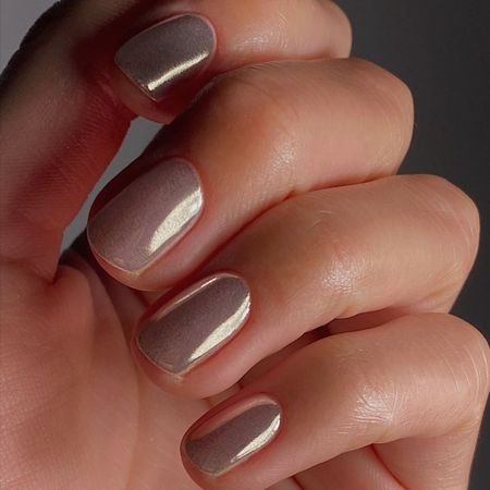 A close-up of glass chrome nails