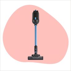 Halo Capsule X cordless vacuum on pink paint splash background