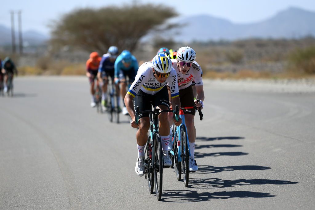 YITTI HILLS OMAN FEBRUARY 14 LR Andrii Ponomar of Ukraine and Team ArkeaSamsic and Stan Dewulf of Belgium and Ag2R Citroen Team lead the peloton during the 12th Tour of Oman 2023 Stage 4 a 2049km stage from Izki to Yitti Hills 147m TourofOman on February 14 2023 in Yitti Hills Oman Photo by Alex BroadwayGetty Images