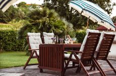 al fresco outdoor patio set-up with umbrella