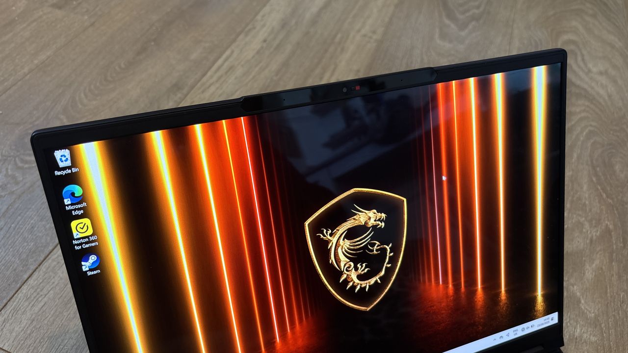 MSI Stealth A16 AI+ on wooden surface