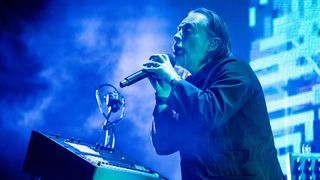 thom yorke on stage with microphone