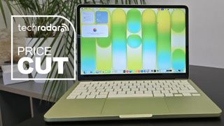 The MacBook Neo during our tests in an office next to a TechRadar badge that reads 'Price Cut'