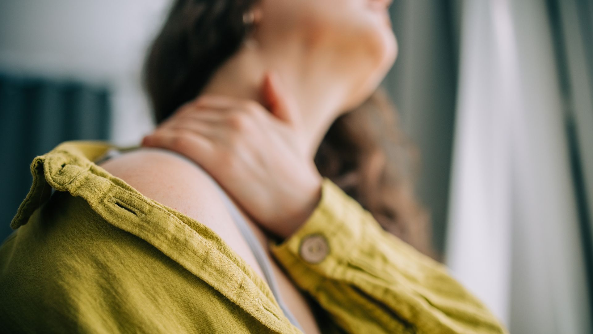 Woman stretching neck and shoulders