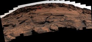 A panorama stitched together from about 100 individual Curiosity images. The ‘door’ is circled, and is tiny and hard to see at this scale.