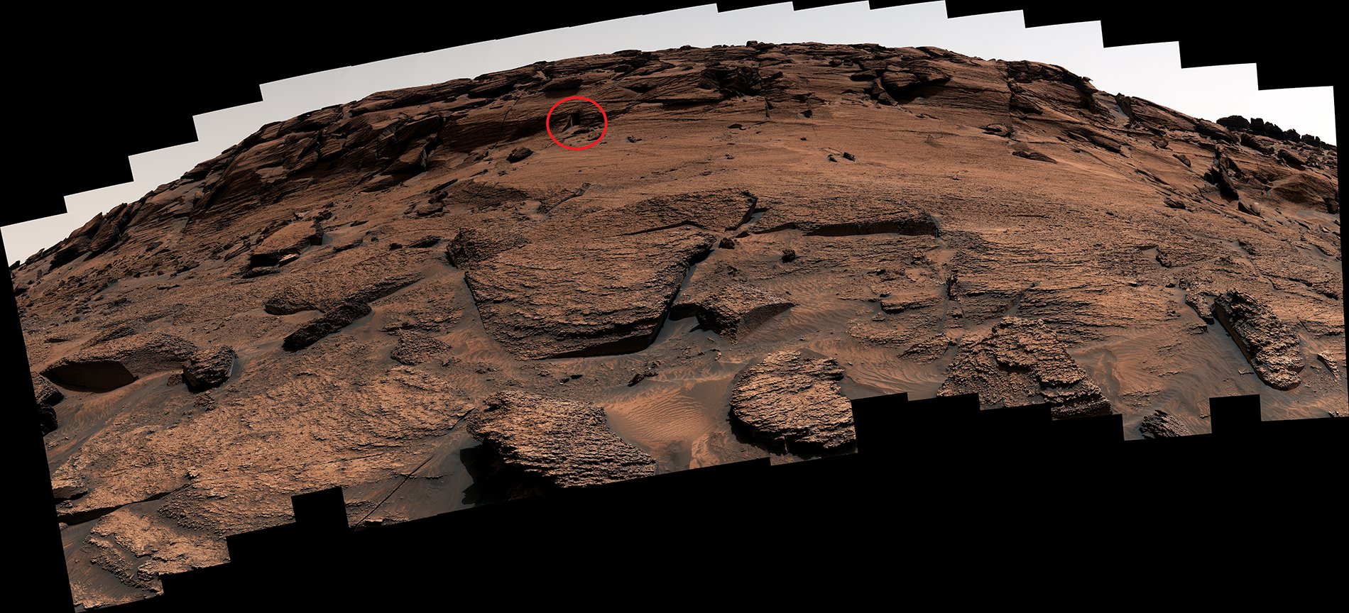 A panorama stitched together from about 100 individual Curiosity images. The 'door' is circled, and is tiny and hard to see at this scale.