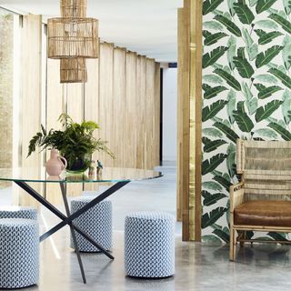 A circular table partnered with pretty upholstered stools