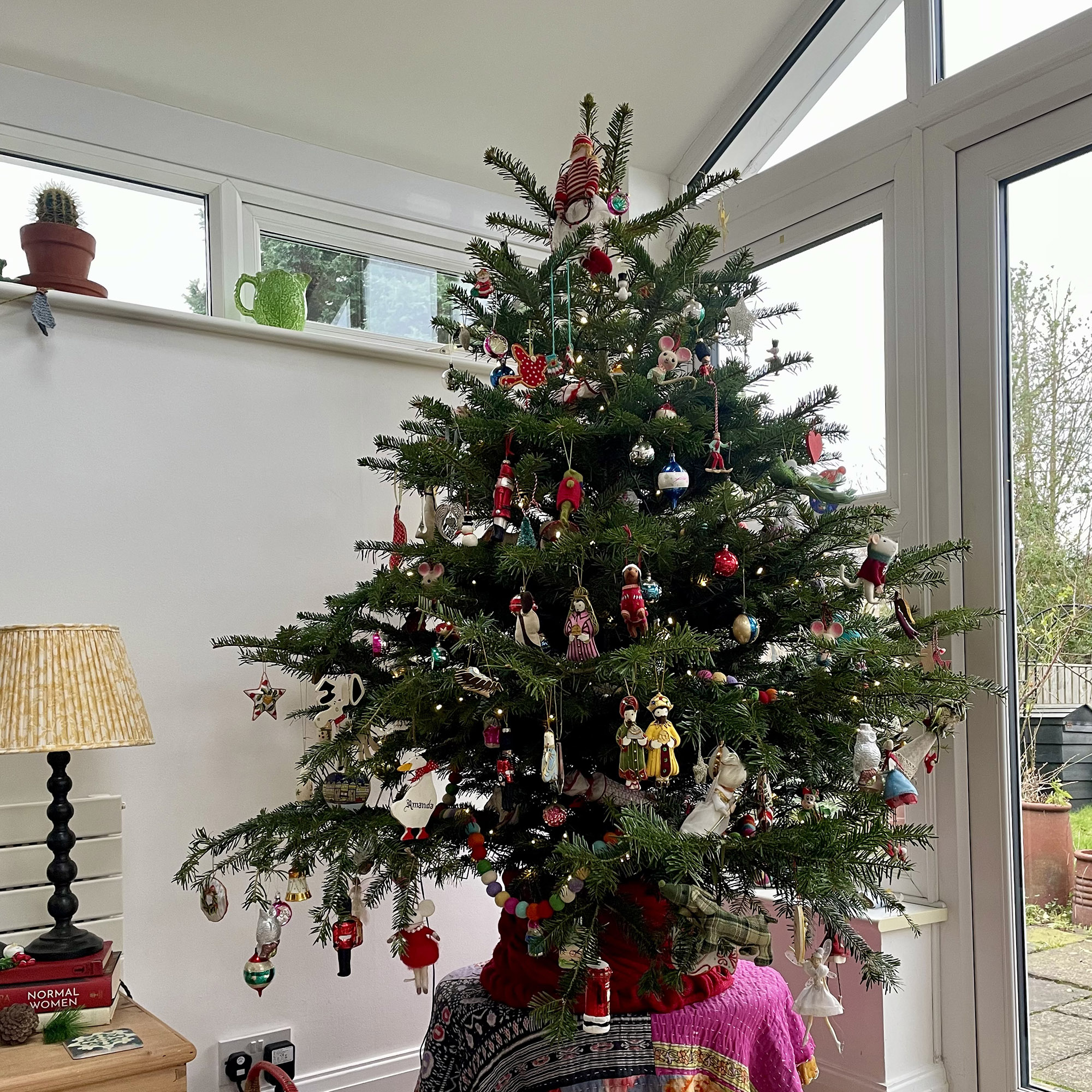 christmas tree decorated with lots of ornaments