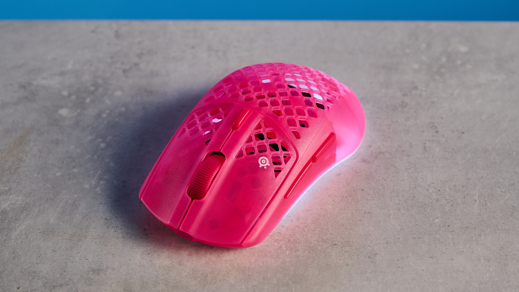 A magenta SteelSeries Aerox 3 Wireless Gen 2 wireless mouse for gaming
