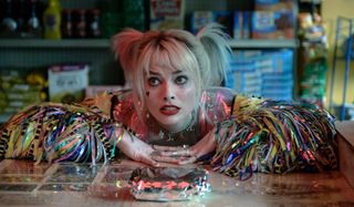 Birds of Prey: Harley Quinn Margot Robbie sits dismayed in front of her egg sandwich