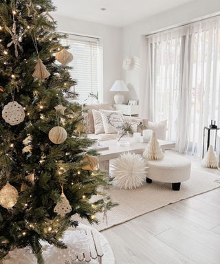A neutral boho Christmas tree, with paper ornaments and a Scandi feel