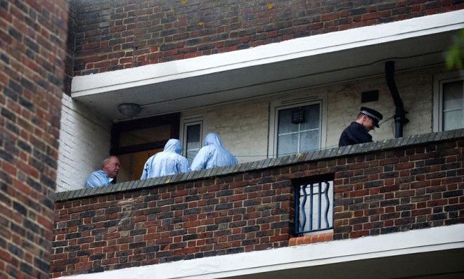 Police search an apartment in south London believed to be the residence of a suspect in the brutal attack on May 22. 