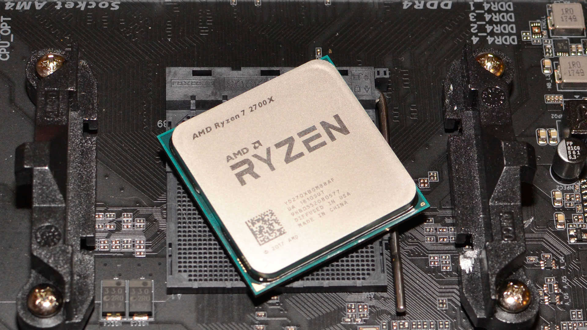 AMD Ryzen CPU sitting atop an AM4 motherboard socket