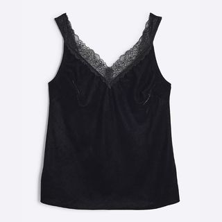 A cut out of a velvet camisole from River Island on a white background