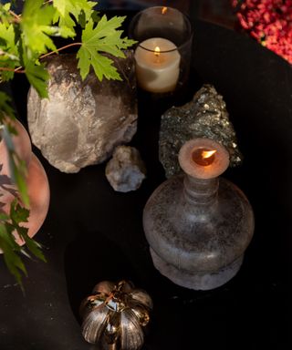 halloween decorating table with crystals and candles