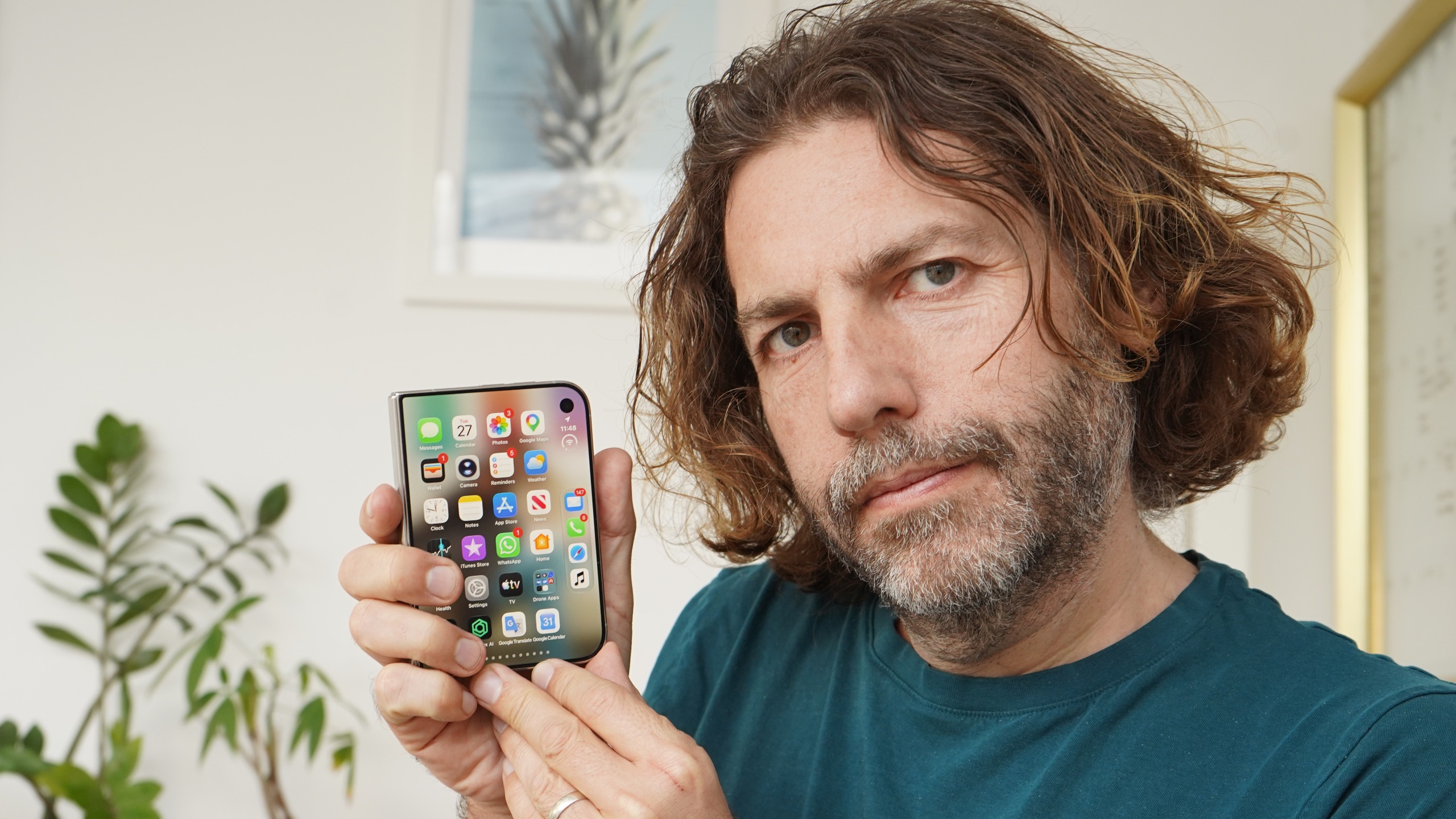 Adam Juniper holding the Apple iPhone Duo