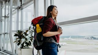 woman at airport with water bottle