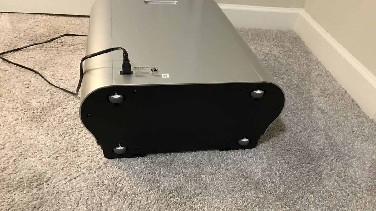 Levoit EverestAir air purifier on its side, showing wheels for moving