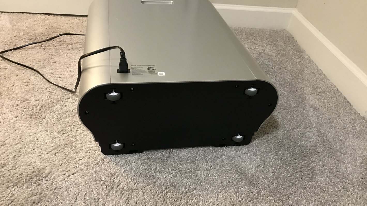 Levoit EverestAir air purifier on its side, showing wheels for moving